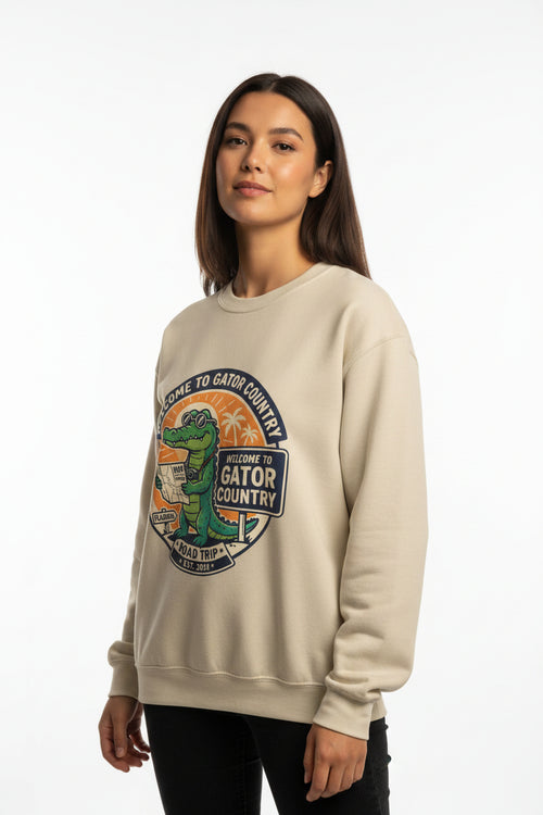 Beige sweatshirt with a graphic of a gator and text 'Welcome to Gator Country' on a white background