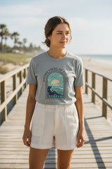 Gray t-shirt with a graphic design of a woman by the sea and 'Daydreaming of the Sea' text on a white background.