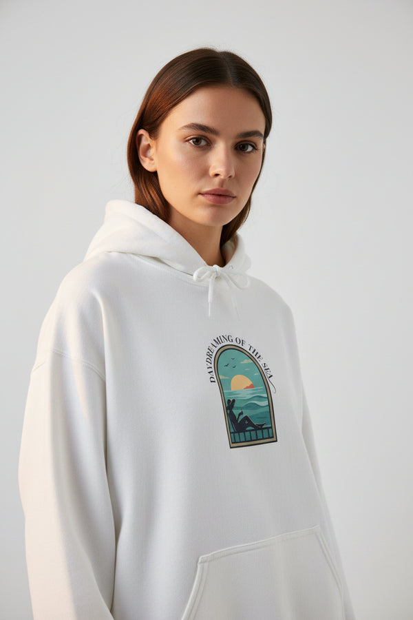 White hoodie with a graphic design on the chest against a white background