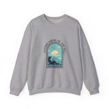 Gray sweatshirt with a graphic design of a person by the sea and 'Daydreaming of the Sea' text on a white background.