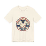 White t-shirt with a baseball-themed graphic and text on a white background