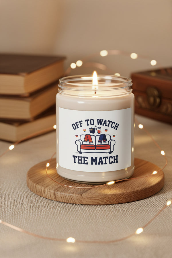 Candle jar with a label reading 'Off to Watch the Match' on a white background